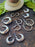 RIVETED MOON HOOPS